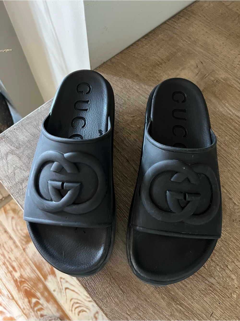 Gucci Women’s Black Embossed Logo Slide Sandals